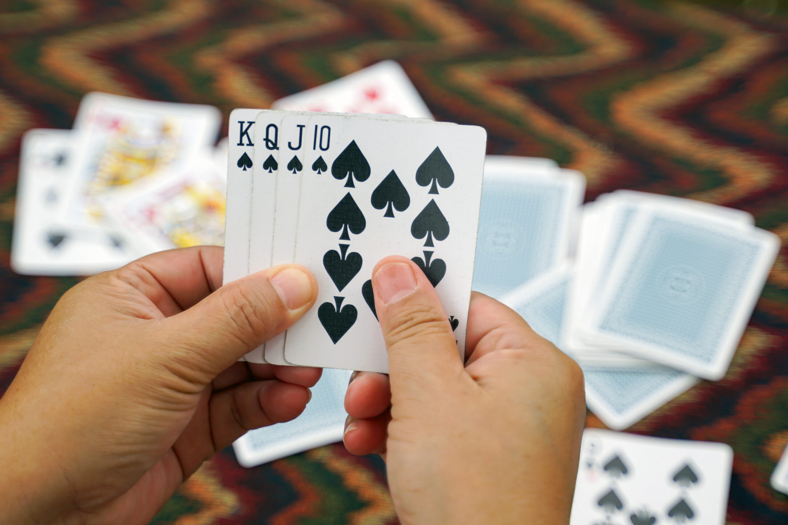 vecteezy close up of cards in player s hand get a king queen jack 13099493 336 scaled